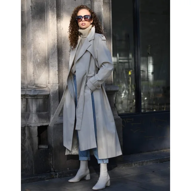 The Kopi coat styled with denim and a roll-neck in the city